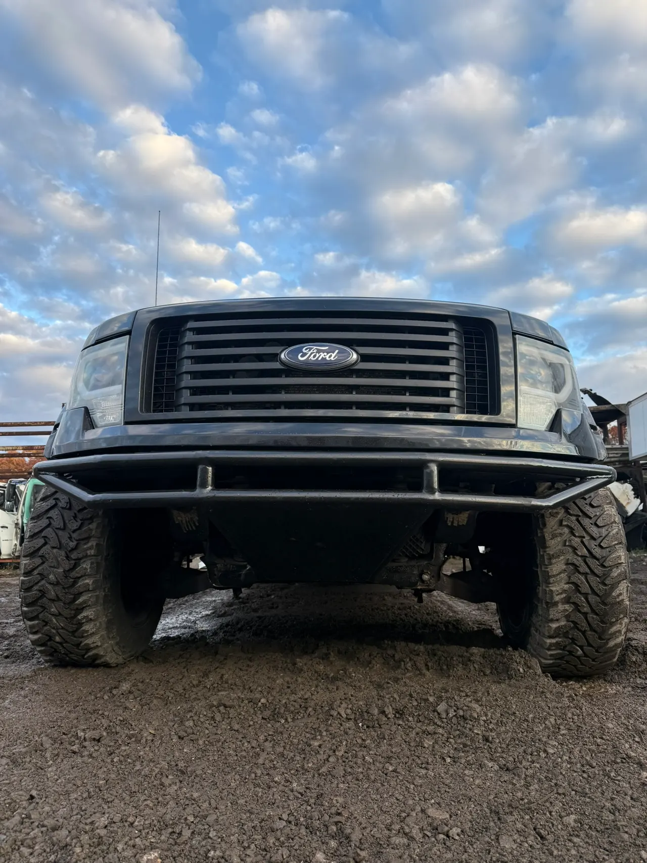 Front of a truck with a custom bent-tube steel bumper fitted
