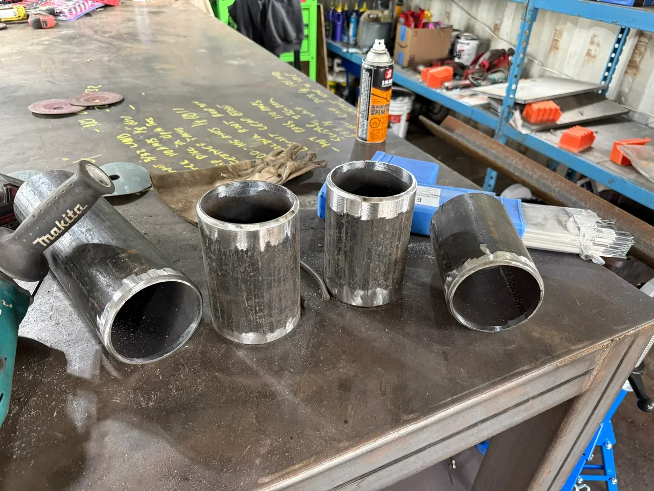 Bevelled 4-inch Schedule 40 black iron pipe fittings on the fabrication bench